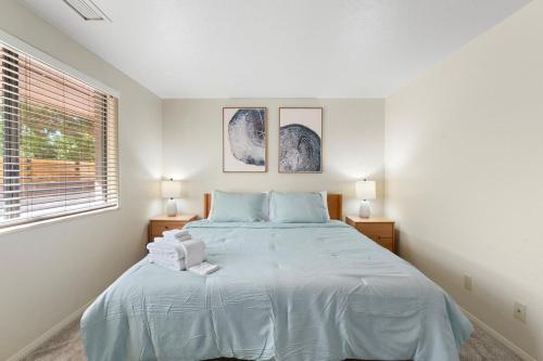 a bedroom with a large bed with blue pillows at Sedona Spacious 2BR Desert Escape in Sedona