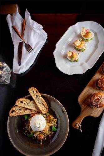 a table with a plate of food with eggs and bread at The Palmer House Hilton in Chicago