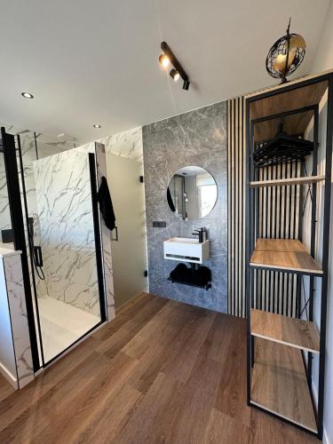 a bathroom with a sink and a mirror at Brisa de Sálvora in Ribeira