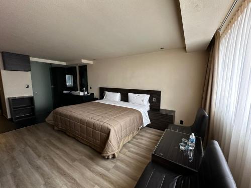 Cama ou camas em um quarto em Hotel Amazonas