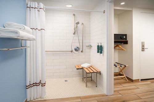 a bathroom with a shower with a shower curtain at DoubleTree by Hilton Grand Key Resort in Key West