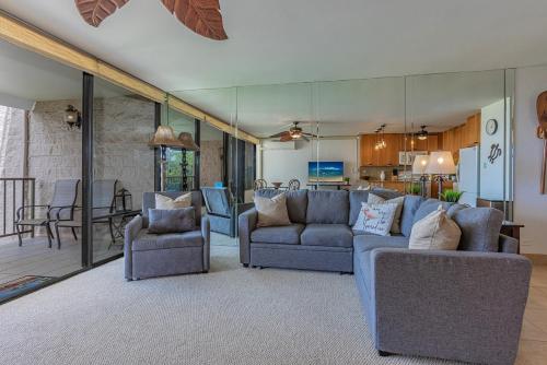 a living room with two couches and a dining room at Kihei Alii Kai Ocean View Condo Pool, Hot Tub, Sauna, AC, Sleeps 4 in Kihei