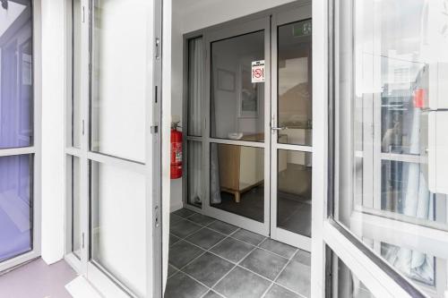 a glass door with a no entry sign on it at Bay View - Lounge Lovers in Lorne