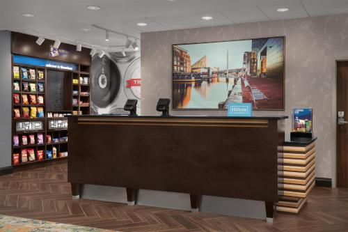 a store with a large screen on the wall at Hampton Inn & Suites Baltimore North/Timonium, MD in Timonium