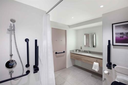 a bathroom with a shower and a sink at DoubleTree by Hilton Glasgow Central in Glasgow