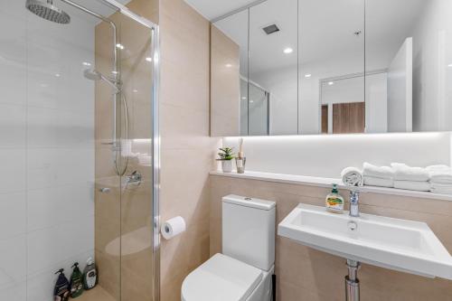 a bathroom with a toilet and a sink and a shower at CBD RiverView 2Bed Apt Kingbed at Tallest building in Brisbane