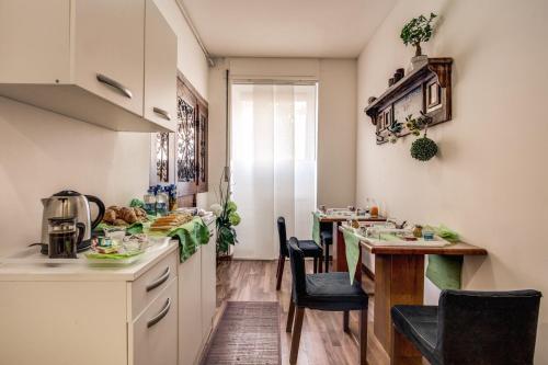 a kitchen with a table and a dining room at Trastevere Rooms in Rome