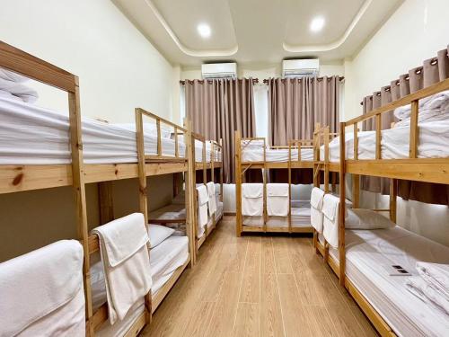 a group of bunk beds in a room at Chiang Mai Private "Davin Pool Villa" CNX 2km to Central Festival in Chiang Mai