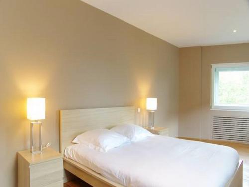 Llit o llits en una habitació de Chateau Trompette - Appartement 4 chambres avec 2 salles de bain et grande terrasse