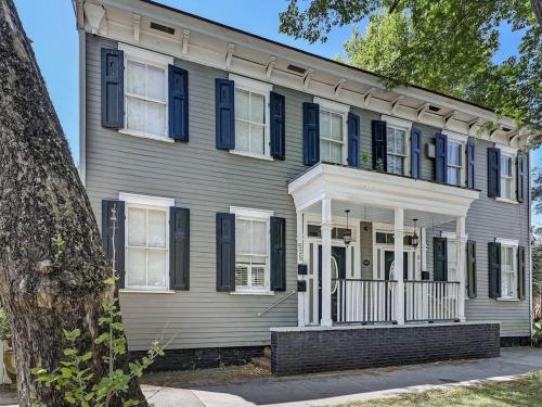 a large house with blue shutters on it at Historic Savannah Condo, Sleeps 6, Pool, Dogs Ok in Savannah