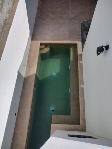 an overhead view of a swimming pool in a building at Casa Mojave in La Paz