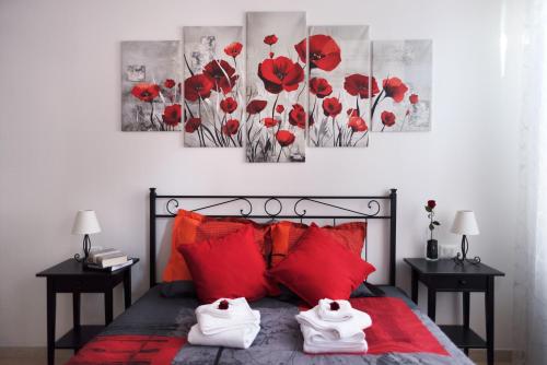 Кровать или кровати в номере Venezia Biennale Bianco & Rosso