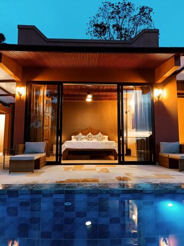a bedroom in a villa with a pool at Indigo House, Villa Fez in San Francisco
