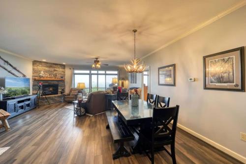 a dining room and living room with a dining table at Sugar Mountain Condo, Sleep 4, Deck Mountain Views in Sugar Mountain