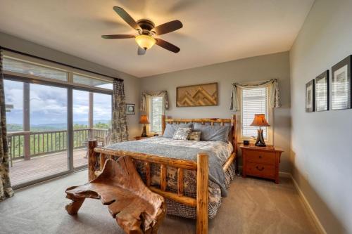 a bedroom with a bed and a large window at Sugar Mountain Condo, Sleep 4, Deck Mountain Views in Sugar Mountain