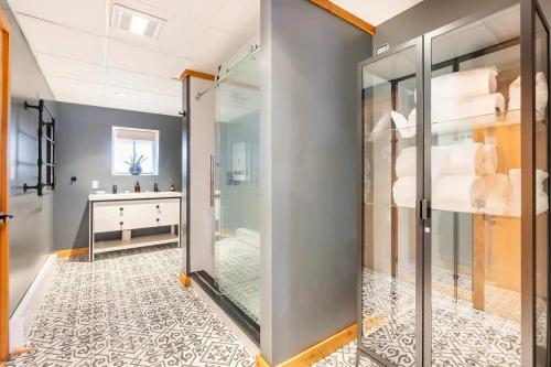 a bathroom with a walk in shower and a sink at Mountain View Chalet Ski, Hot Tub, Firepit, Games in Lexington