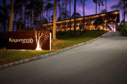 a building with a sign on the side of a road at Wyndham Panbil Batam in Batam Center