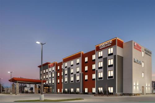 a rendering of a hotel building with a gas station at Hilton Garden Inn Wichita Airport in Wichita