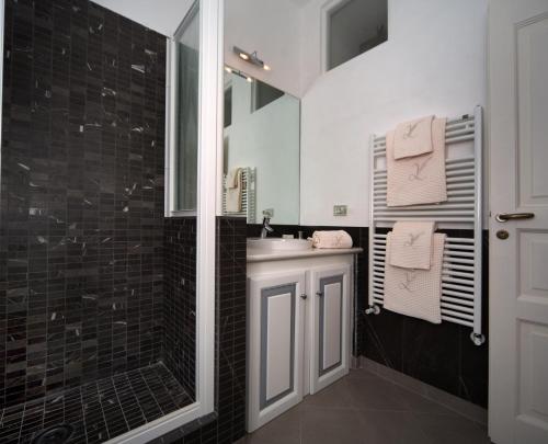 a bathroom with a sink and a mirror at Villa Lieta in Ischia