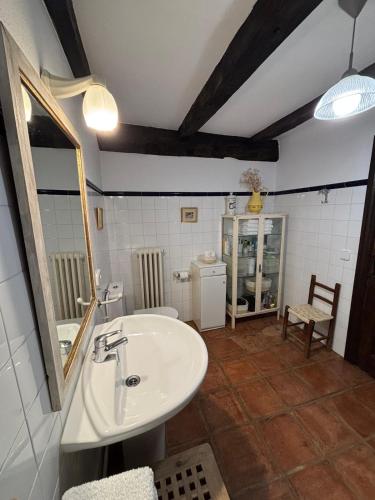 a bathroom with a sink and a mirror at Iregi Natura Casa Rural in Oskotz