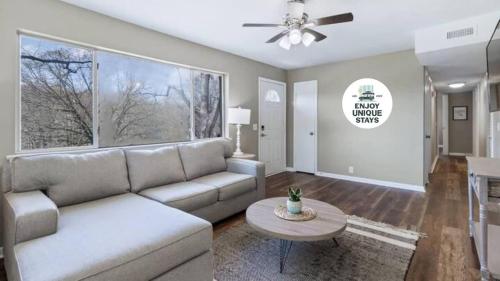 a living room with a couch and a table at Quiet Getaway, Travis' Place! Affordable Location in Rossville