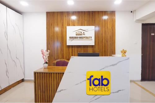 an office with a ibid huts sign on a desk at FabHotel Vardhan Plaza in Pune