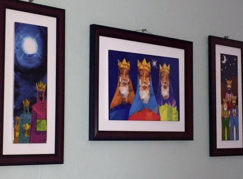 three pictures of cats are hanging on a wall at Brisas de Borinquen in Aguadilla
