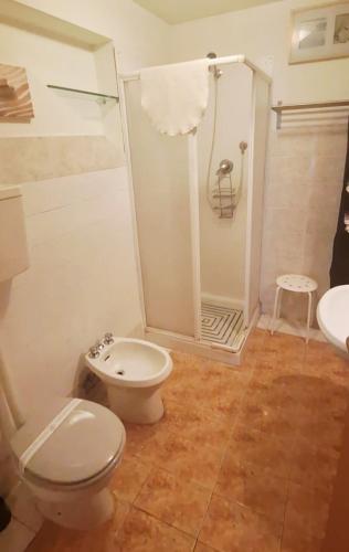 a bathroom with a toilet and a shower at B&B Nuova Loggia in Fabriano