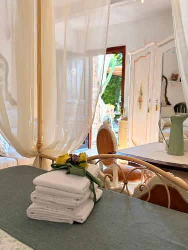 a pile of towels sitting on top of a table at Ca' Datu in Finale Ligure