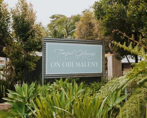 a sign for a hotel future on obidianway at Tranquil Getaways On Obi Maleny in Maleny
