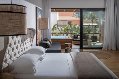 เตียงในห้องที่ Casa Maria Malia