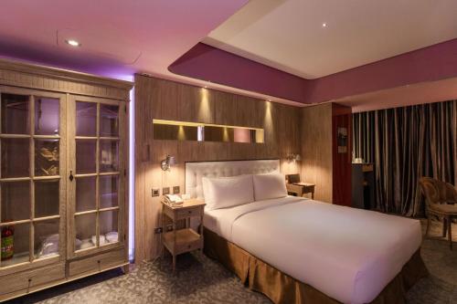 a bedroom with a large white bed in a room at inhouse Hotel in Taipei