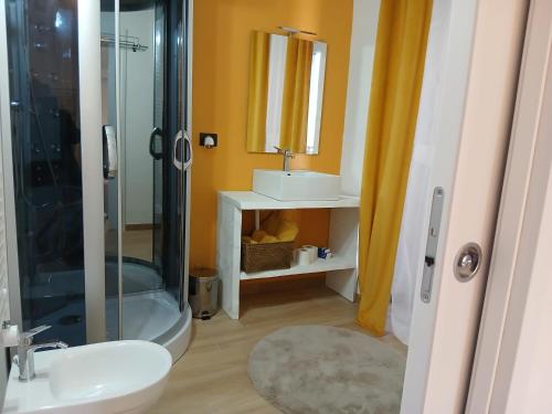 a bathroom with a sink and a shower at Casa Carlotta in Perledo