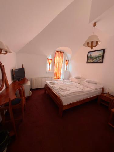 Postel nebo postele na pokoji v ubytování Fodor Hotel