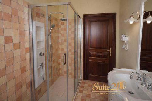 a bathroom with a shower and a toilet and a sink at Suite 21 - Residence Contini in Falconara Marittima
