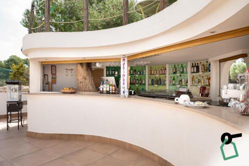 a view of a bar in a building at Hotiday Gallipoli Spiaggia in Baia Verde