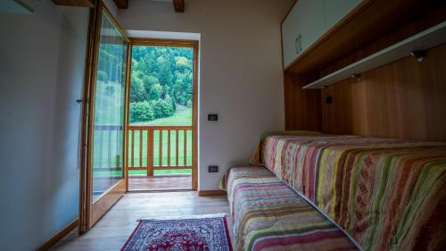 Postel nebo postele na pokoji v ubytování Rustico Pastoria