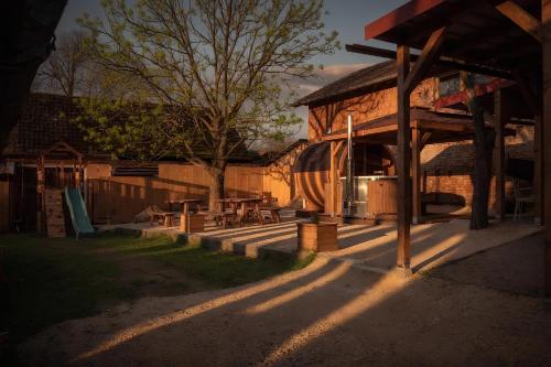 a building with a picnic table in front of it at KLOBUCKÉ RETRO bydlení a wellness in Valašské Klobouky