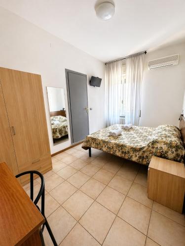 En eller flere senge i et værelse på BaB Hotels and Apartments Helvetia