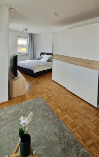 a bedroom with a bed and a tv in a room at Cozy and beautiful flat in the centrum in Essen
