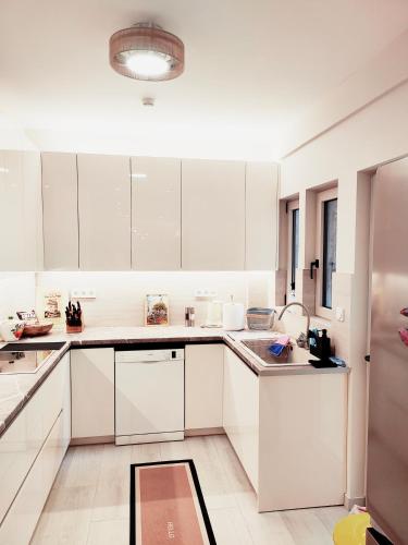 THALIA, luxury 3Br Home with Ensuite Bathrooms, just 3 minutes walk from the beach located in the prestigious Athenian Riviera
