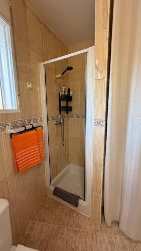 a bathroom with a shower with a glass door at Peniscola Bella in Peniscola
