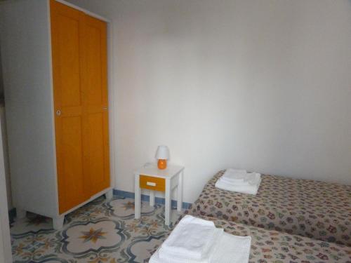 Postel nebo postele na pokoji v ubytování Camere D'Aragona