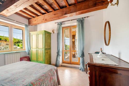 a bedroom with a bed and a sink and a window at Collazzone - "Il Tramonto" casale con piscina in Collazzone