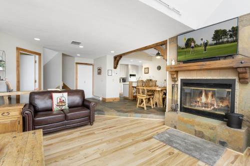 a living room with a couch and a fireplace at 770 Potato Patch townhouse in Vail