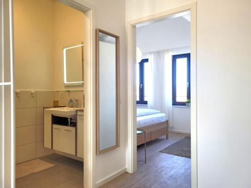 a bathroom with a sink and a mirror at Heiligenhafenbude 2 in Heiligenhafen