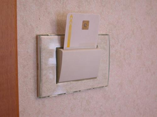a mirror on a wall with a box on it at Hotel La Pergola in Rionero in Vulture