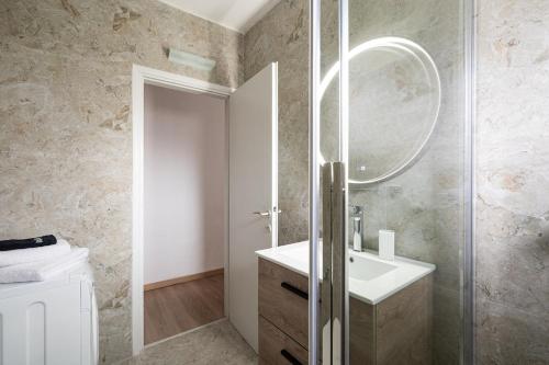 a bathroom with a sink and a mirror at Olympus & Sea Harmony in Katerini
