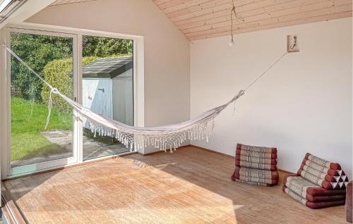 a hammock in a living room with a window at 3 Bedroom Gorgeous Home In Faaborg in Faaborg