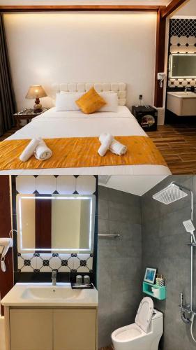 a bedroom with a bed and a bathroom with a sink at Dreamers Farm in Vinh Thanh